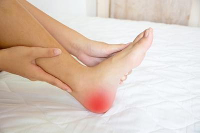 Woman experiencing heel pain