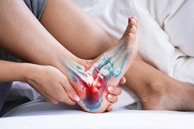Woman experiencing pain from foot fracture