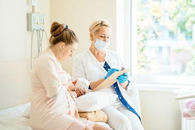 New mother receiving expert advice on nursing and lactation.
