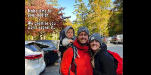 Dr Parker Neill and Dr Abbie Swank out hiking in a beautiful fall scene with their son in a back pack. The words beside them say,"Make Time for Your Health, We promise You won'r Regret iT!"