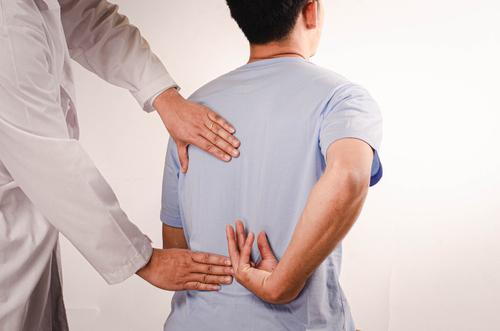 Chiropractor providing treatment to a patient for back pain relief
