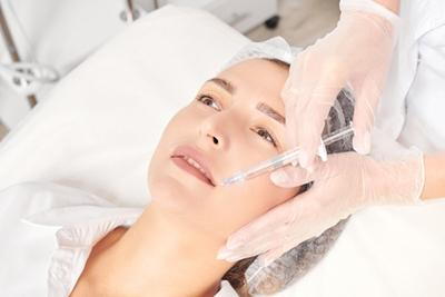 Procedure of Dermal Filler on face of a woman