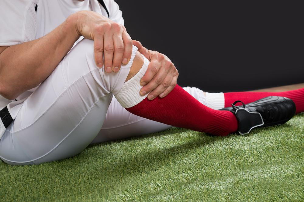 an athlete experiencing sprains and strains