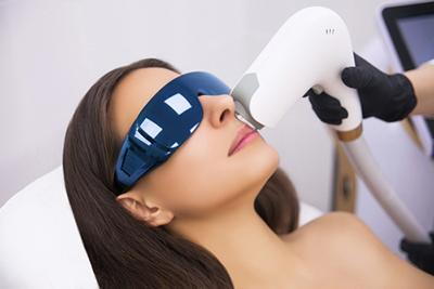 Applying-Laser-Therapy-in-Woman's-Face.