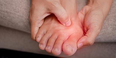 Woman-Holding-and-Pressing-Her-Bunion