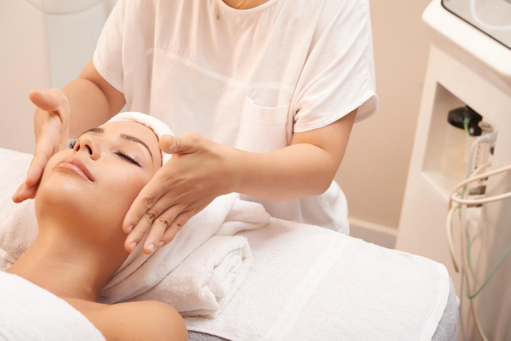 Young Woman Receiving Facial Massage