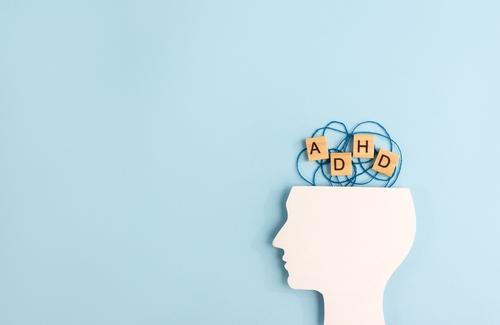 ADHD concept shown with head silhouette and letter blocks
