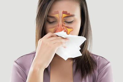 Woman suffering of Nasal congestion or sinusitis.