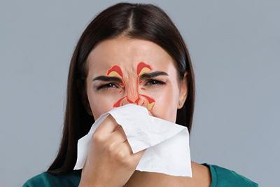 Woman affected by chronic sinus condition.