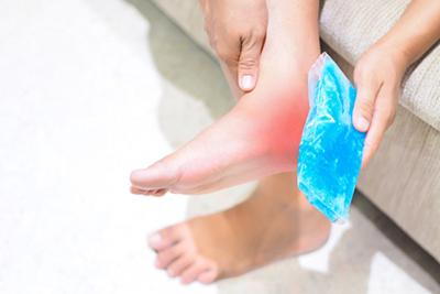 Man-Suffering-From-Heel-Pain-Uses-Gel-Ice-Pack-to-Relieve-Pain
