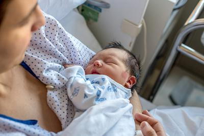 Mother taking care of her newborn baby