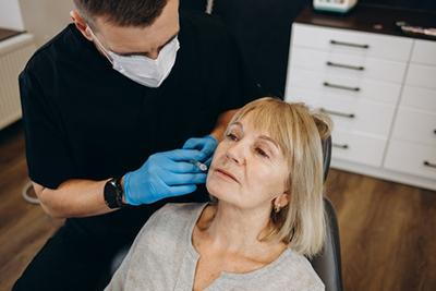 Botox procedure on face of a senior woman