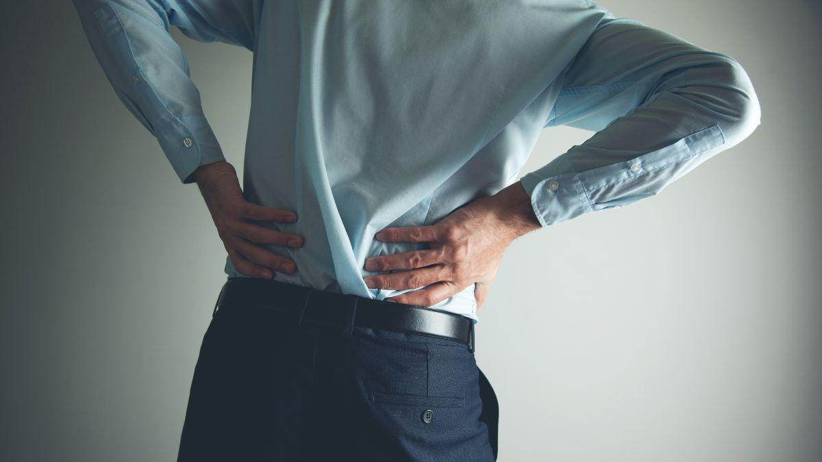 Person Suffering From Lower Back Pain