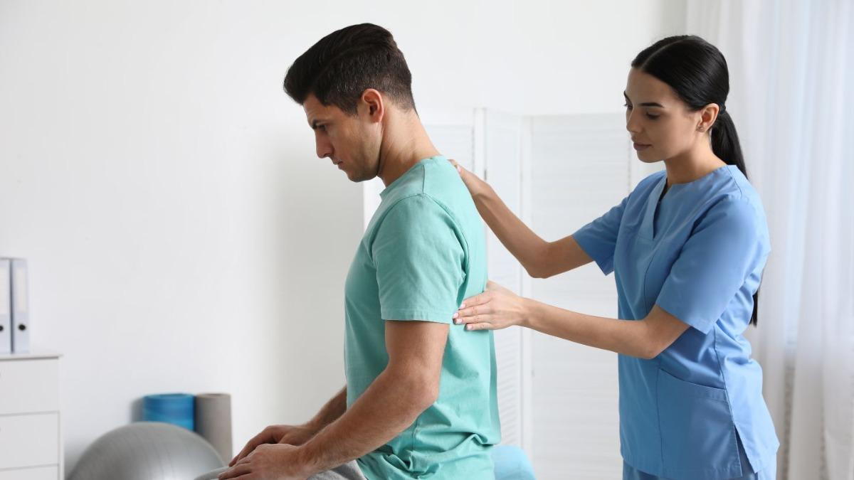 Chiropractor Performing Spinal Adjustment