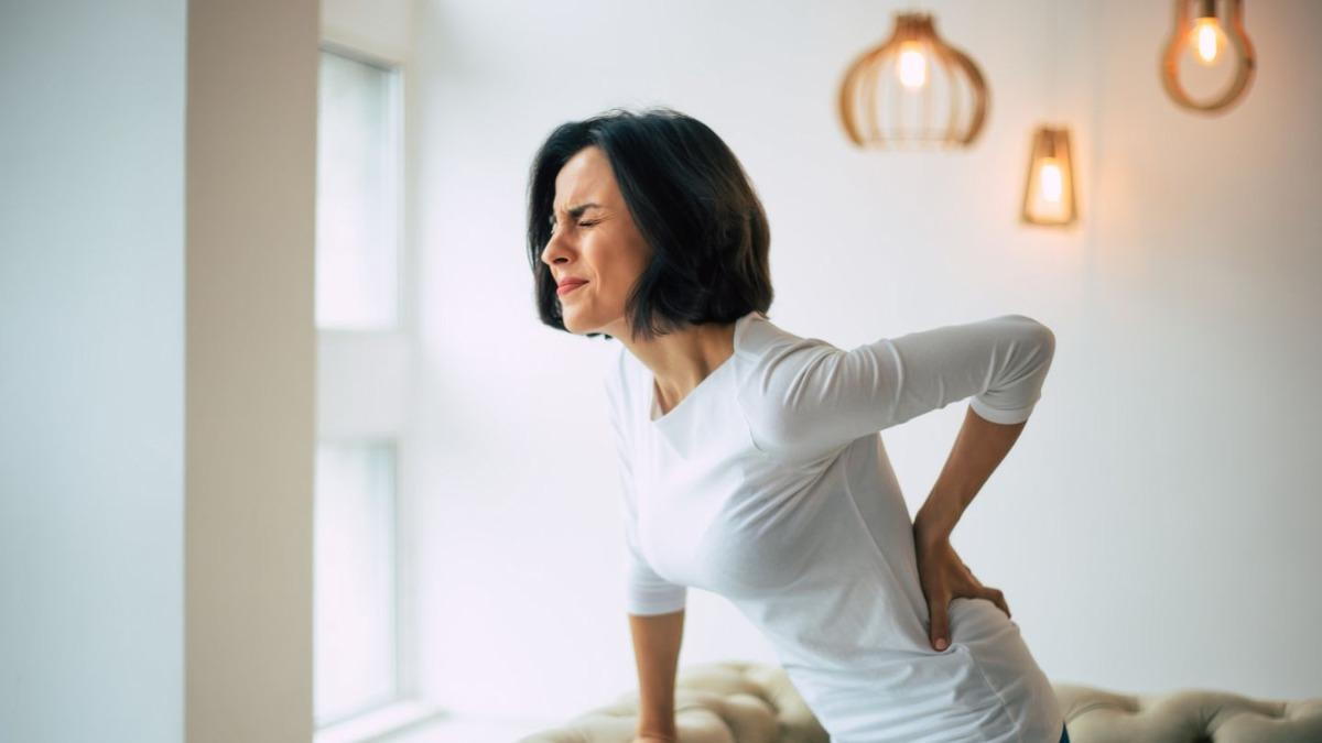 Woman Suffering From Lower Back Pain