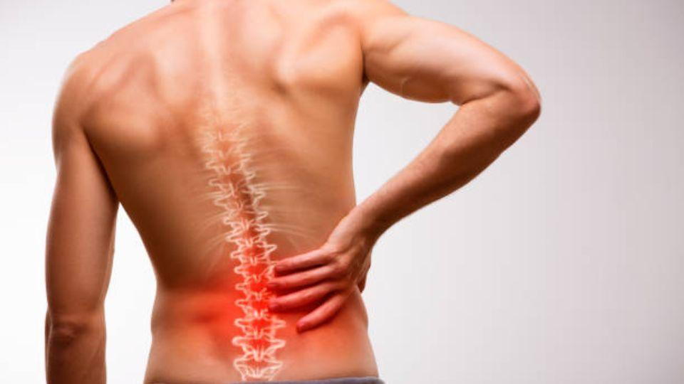 Man Holding His Back With Pain