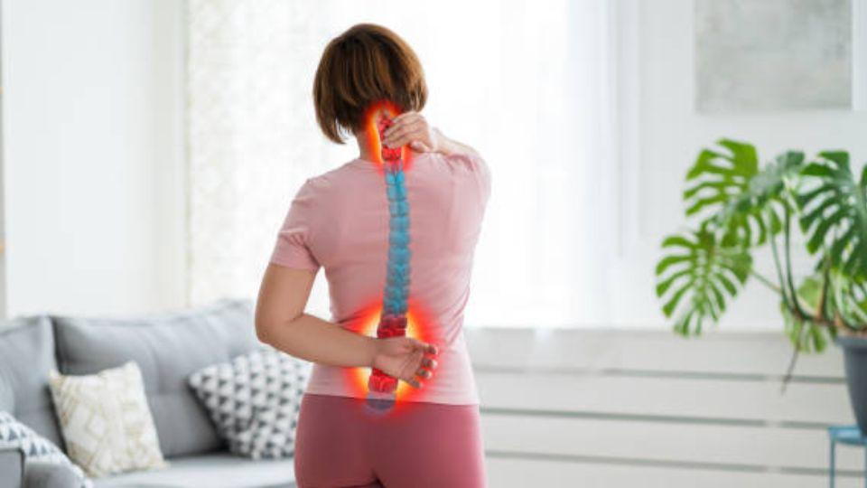 A Women At Home With Upper &amp; Lower Back Pain
