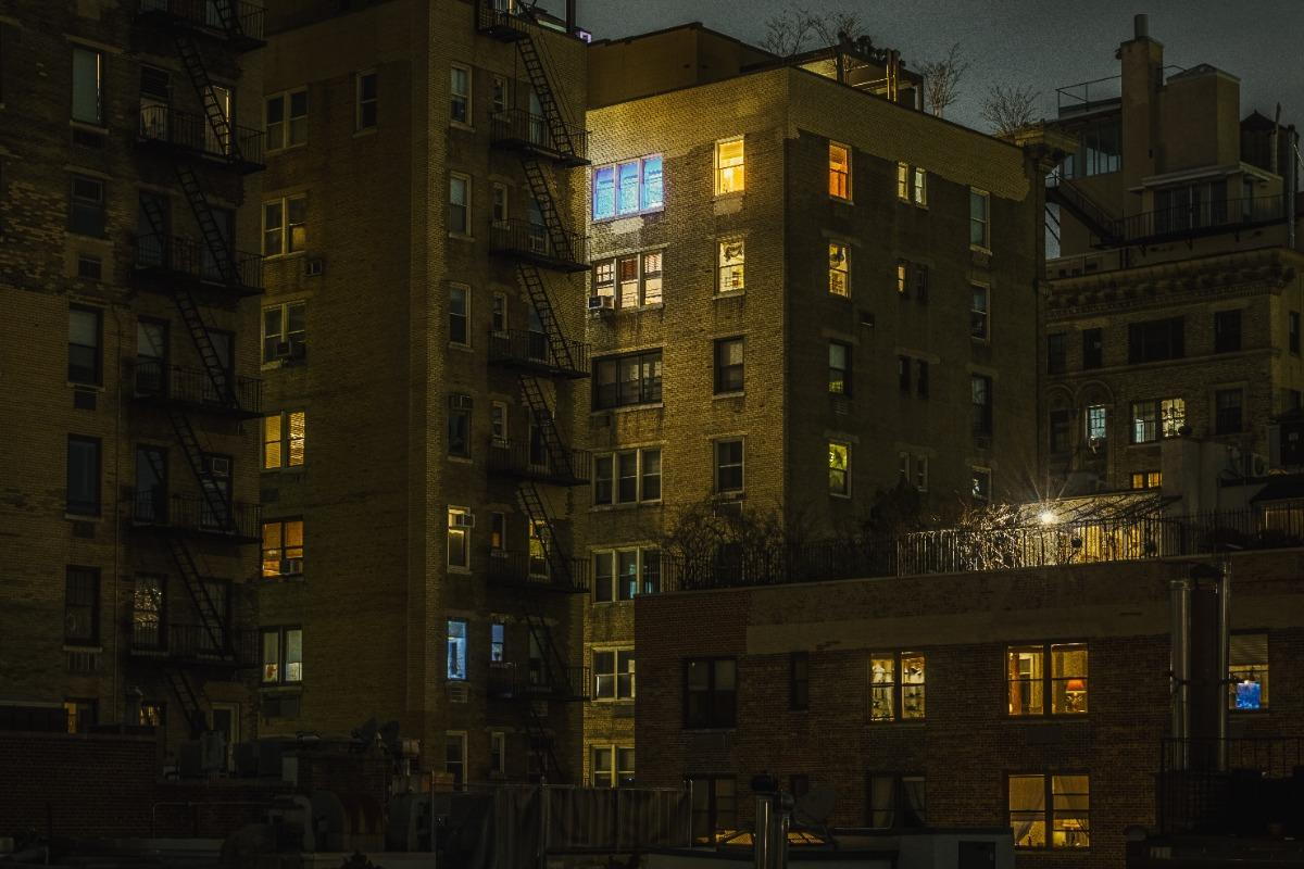 An apartment in New York glows gently in the night