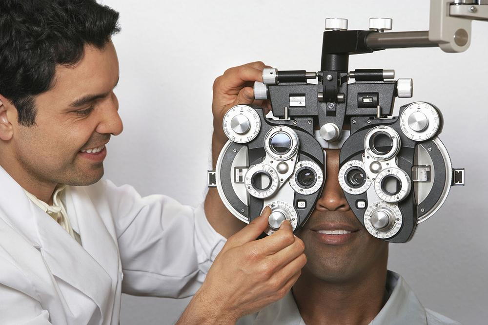 man getting an eye exam from his optometrist