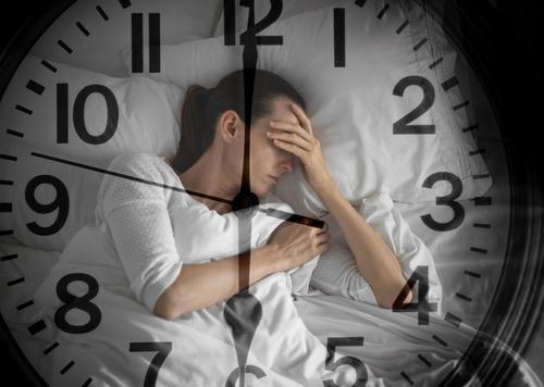 A woman sleeping with a clock overlay, illustrating the importance of restful sleep.