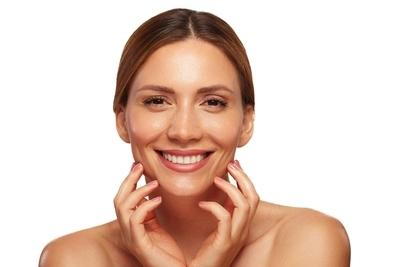 Flawless woman's face smiling on camera