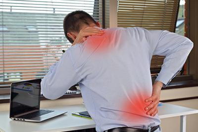 Man-in-pain-with-red-highlights-at-work.