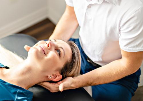 Woman-adjusting-the-neck-by-a-chiro-doctor.