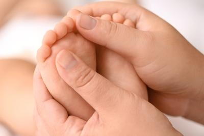 Doctor checking the condition of foot on child