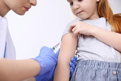 Young girl receiving vaccination for immunization