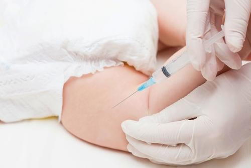 Baby-is-ready-for-immunization-injection-from-doctor-with-gloves.