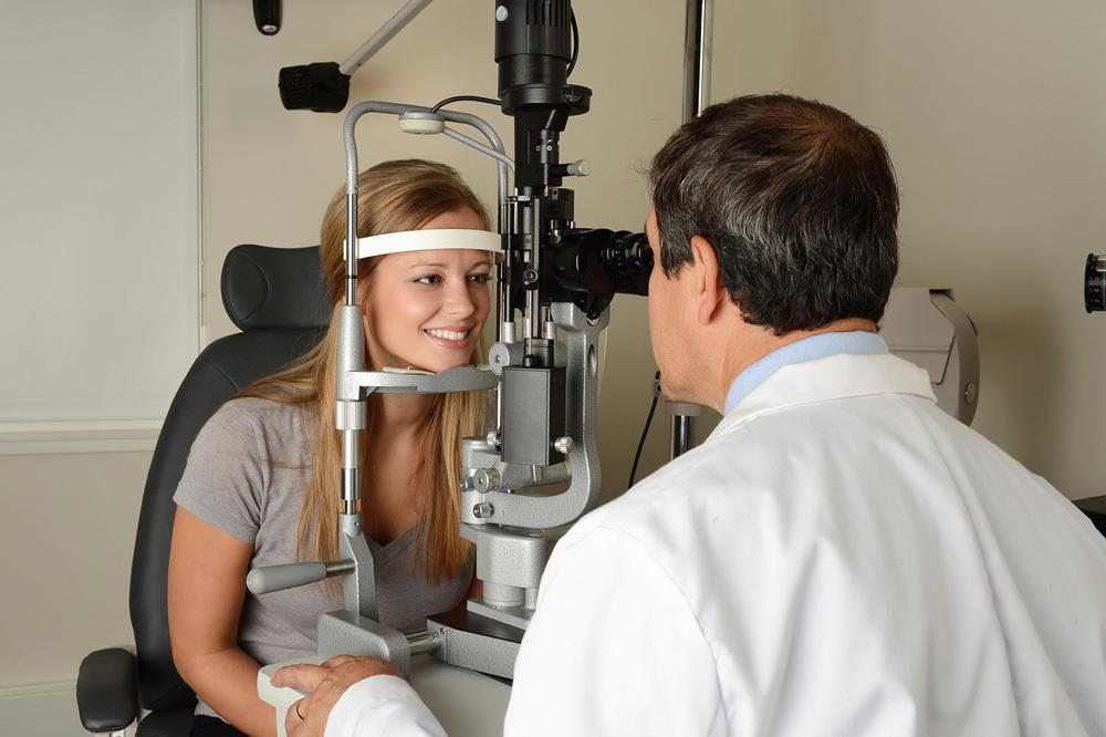 Woman getting a contact lens exam.