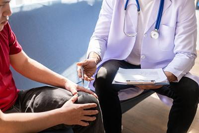 Patient talking to a doctor with notes