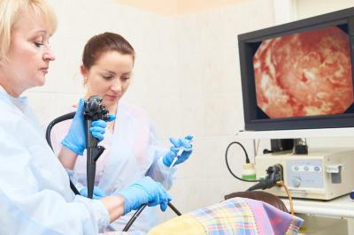 Doctor with clinical assistant on Upper Endoscopy process.