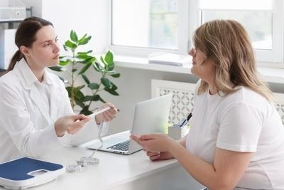 Obese woman consulting the doctor on weightloss