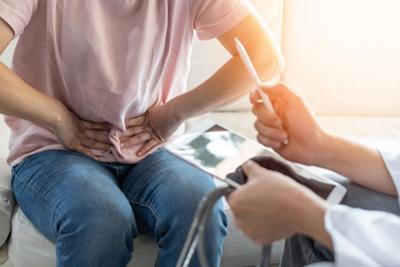 GI-Doctor-Discussing-with-Patient-About-her-Stomach-Pain