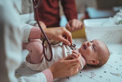 Doctor checking the newborn on clinic.