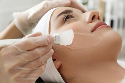 Procedure of Chemical Peel Treatment on womans face