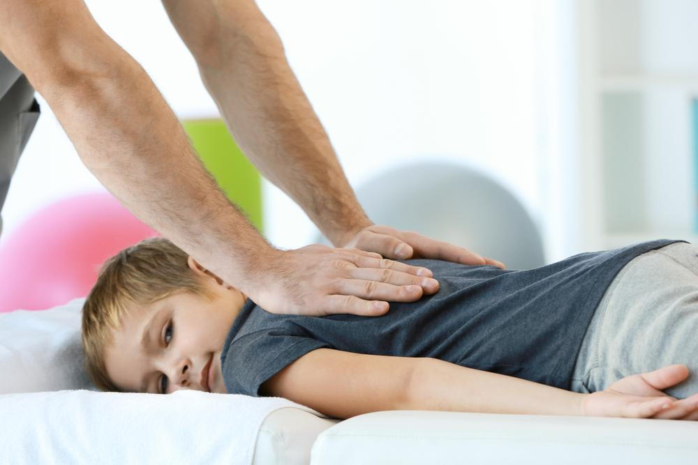 boy getting chiropractic care in Omaha