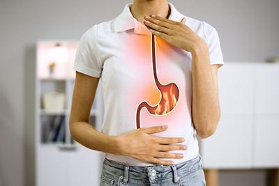 Woman experiencing a burning sensation in her chest