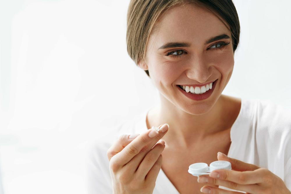 women is smiling with her contact lens case in Stratford and Bridgeport