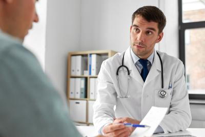 Doctor-concerned-the-health-of-patient-with-note-in-clinic.