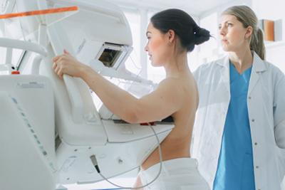 Young woman during routine mammogram exam for early detection