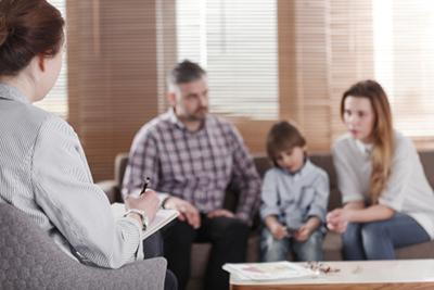 Family attending therapy to strengthen communication and connection