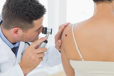 Dermatologist-Conducting-Skin-Check-for-Moles
