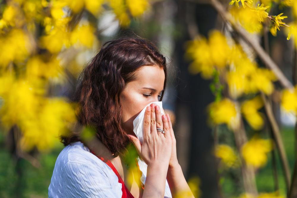 woman suffering from eye allergies in the spring