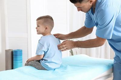 pediatric chiropractic adjustment session for kid