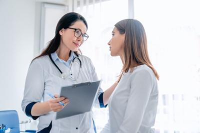 Woman visiting gynecologist for routine women’s wellness exam