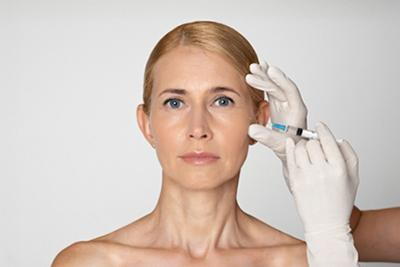 Procedure of wrinkle treatment on face of a woman