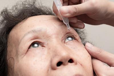 Glaucoma treatment for senior woman with medicated eye drops