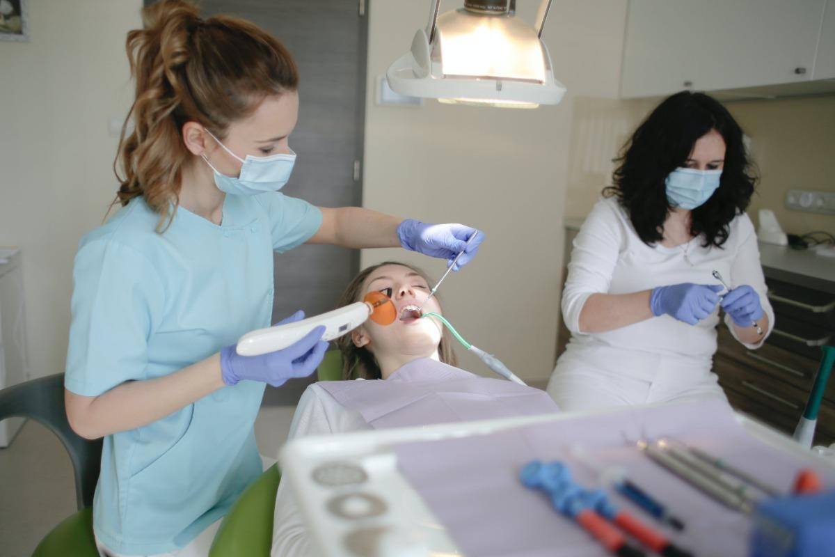A woman having a dental procedure at the dentist